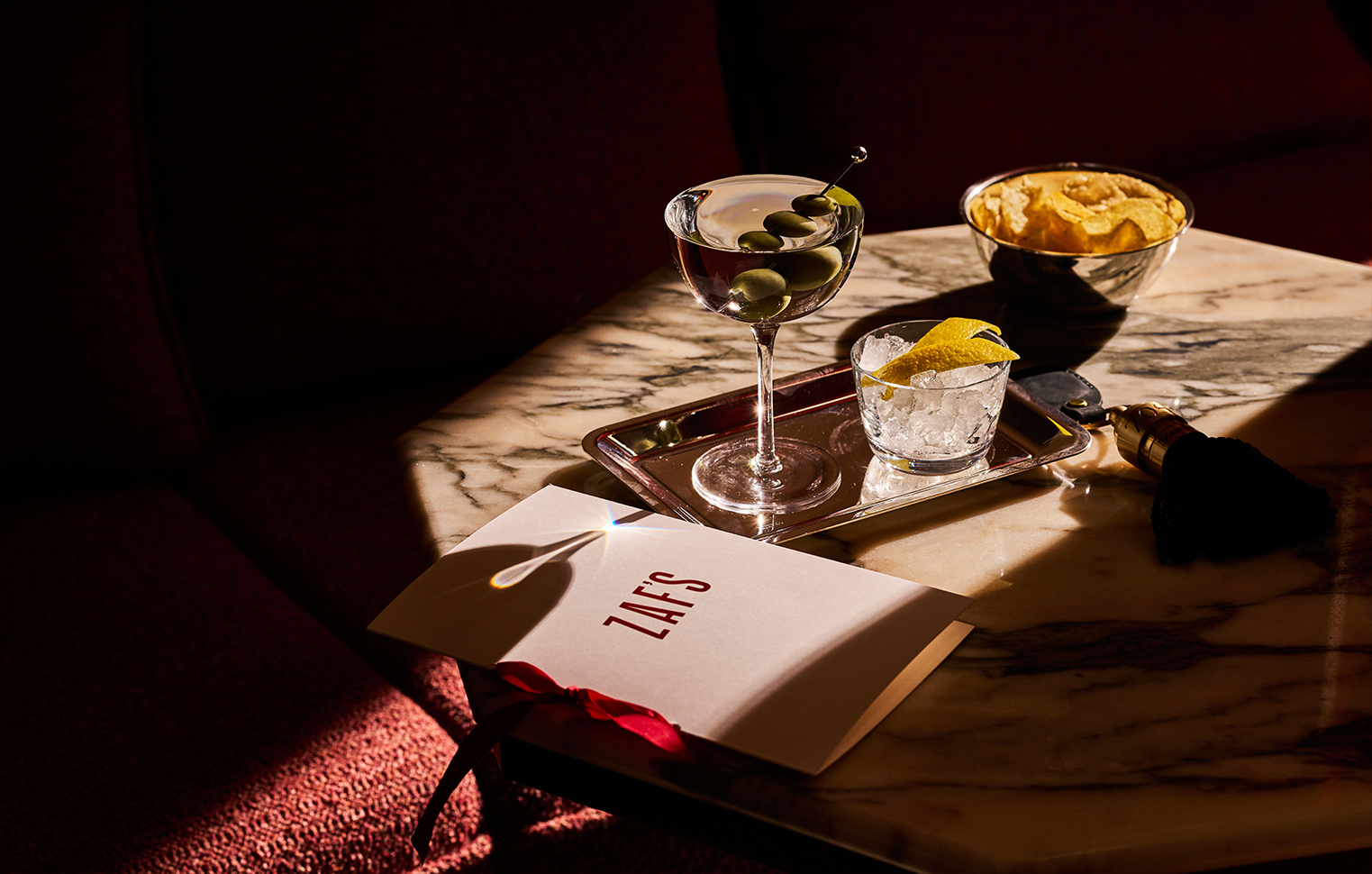 Classic dirty martini served at The Twenty Two New York bar, garnished with olives for a refined cocktail experience.