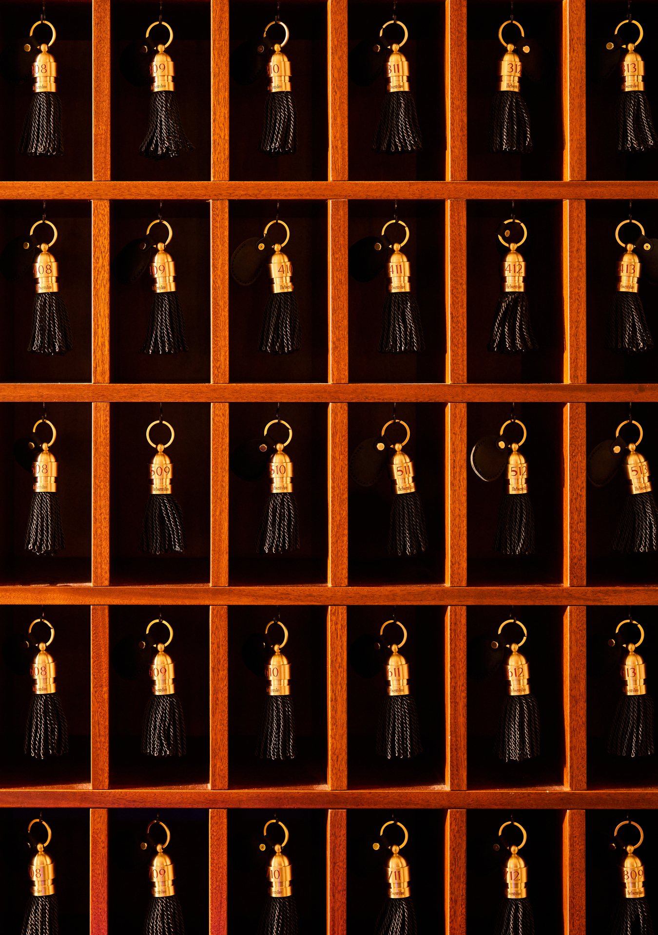 Vintage-style keys hanging at the check-in area of The Twenty Two New York, showcasing the hotel's classic and elegant touch.